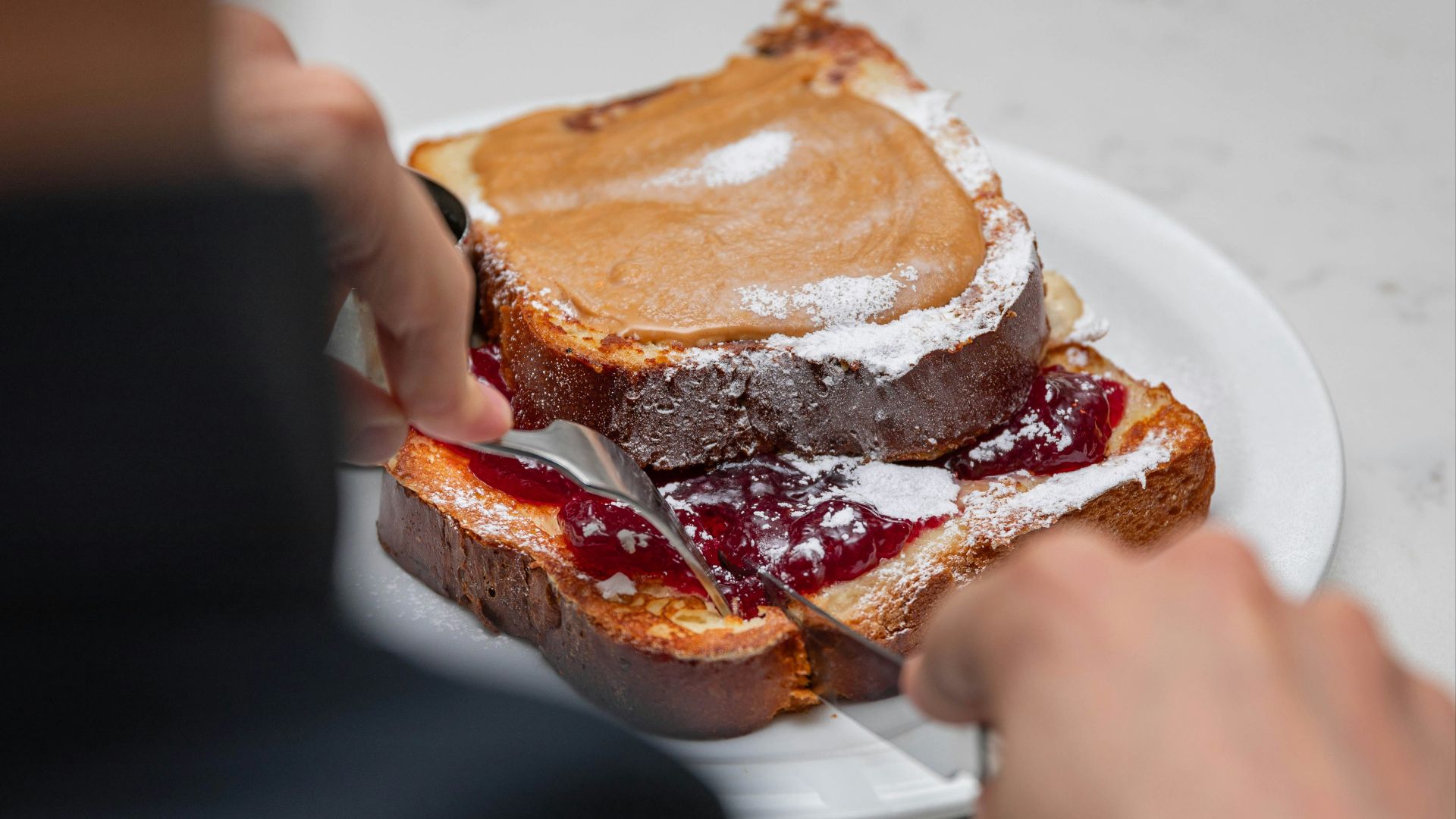 a person eating a sandwich