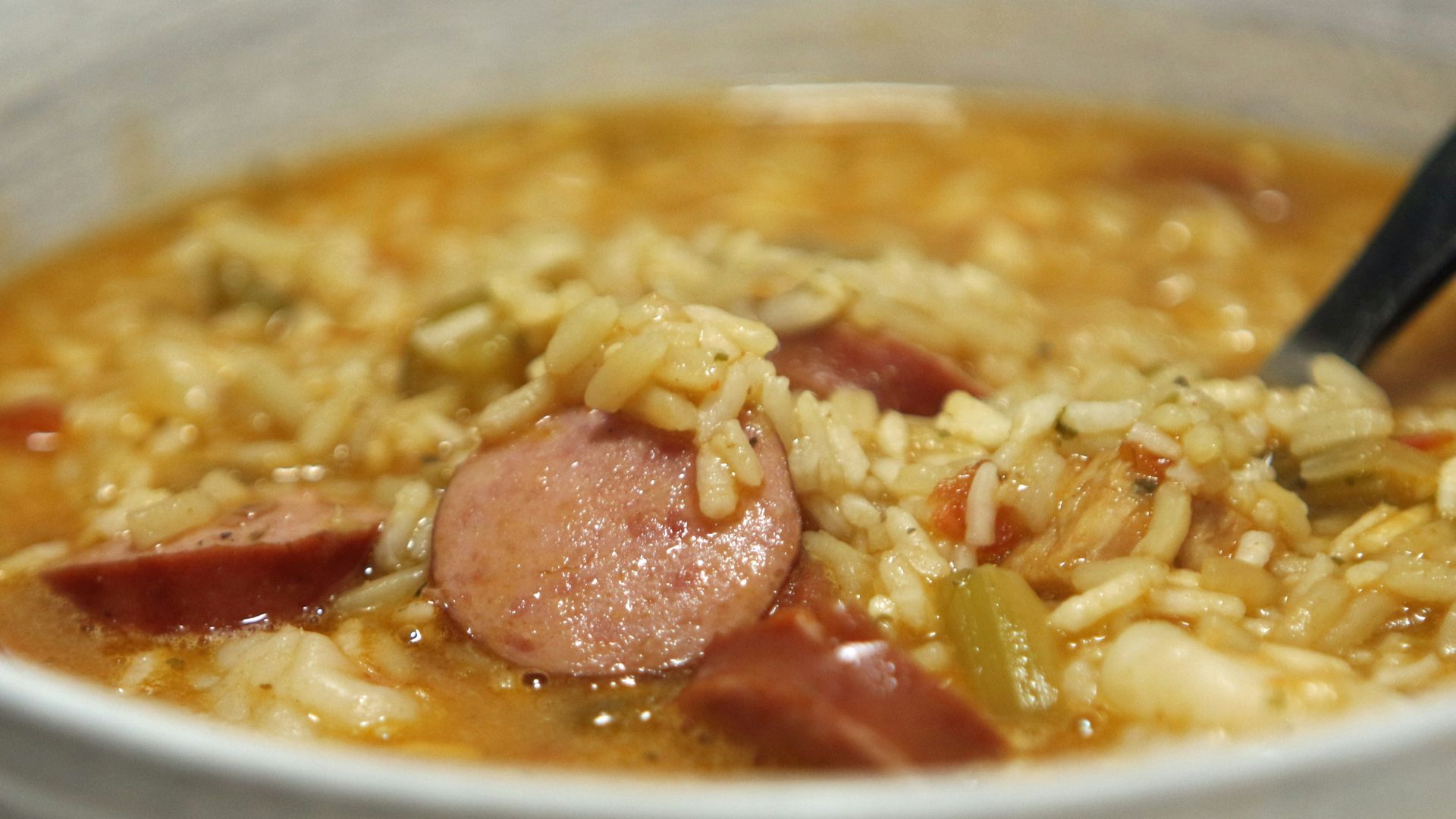 a bowl of soup with a spoon in it