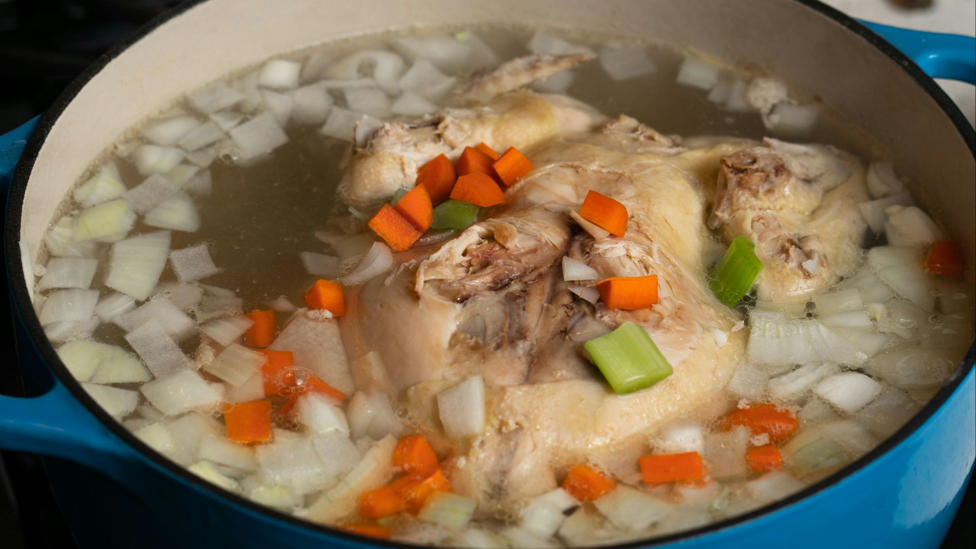 white rice with green peas and carrots in blue ceramic bowl