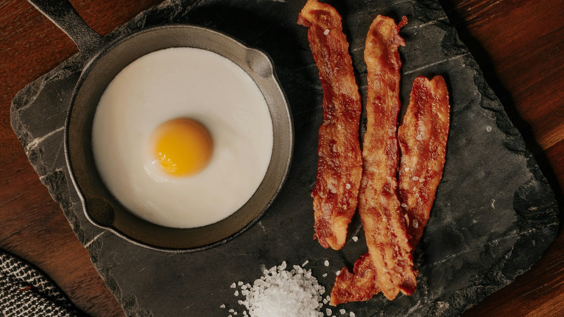 white egg on black plate