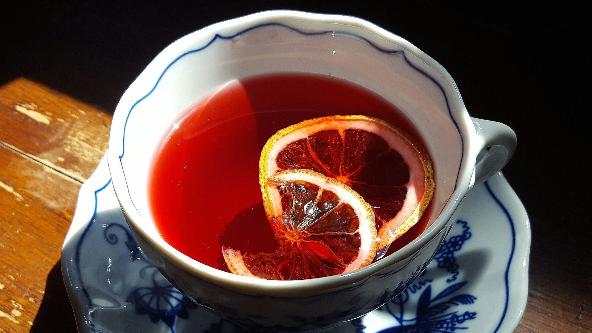 white ceramic teacup with tea