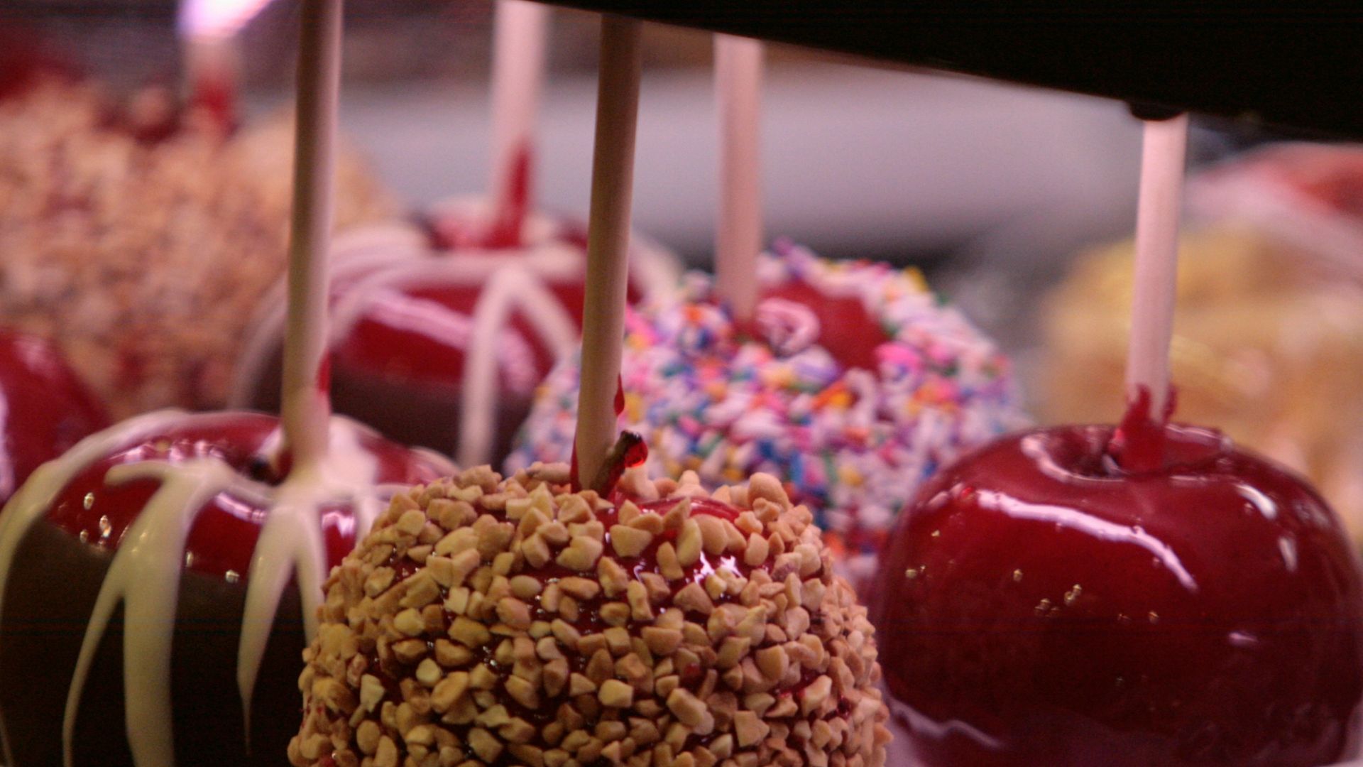 a group of fruits with sticks in them