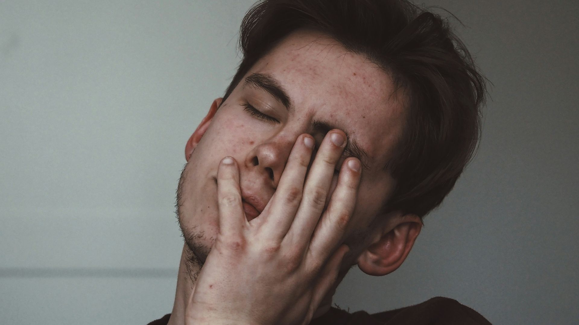 man wearing black crew-neck top