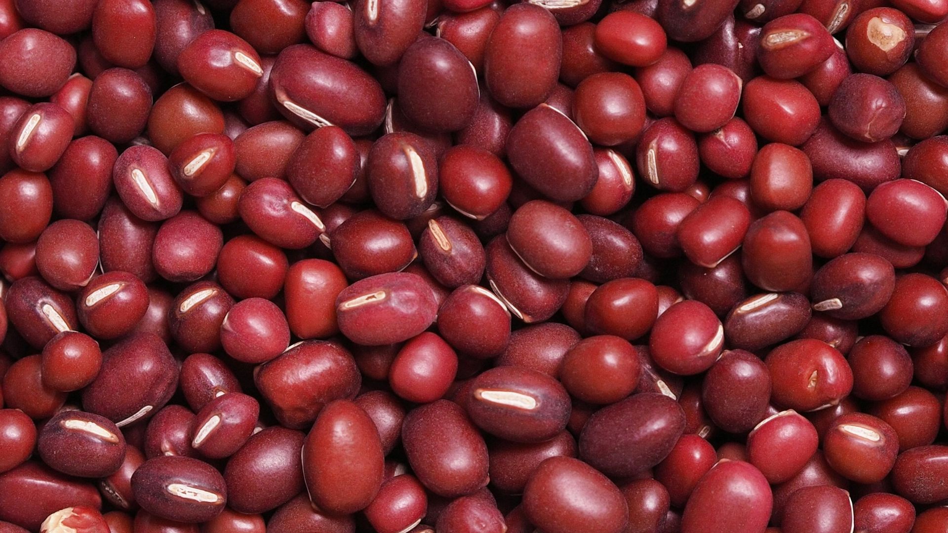 red round fruits on white surface