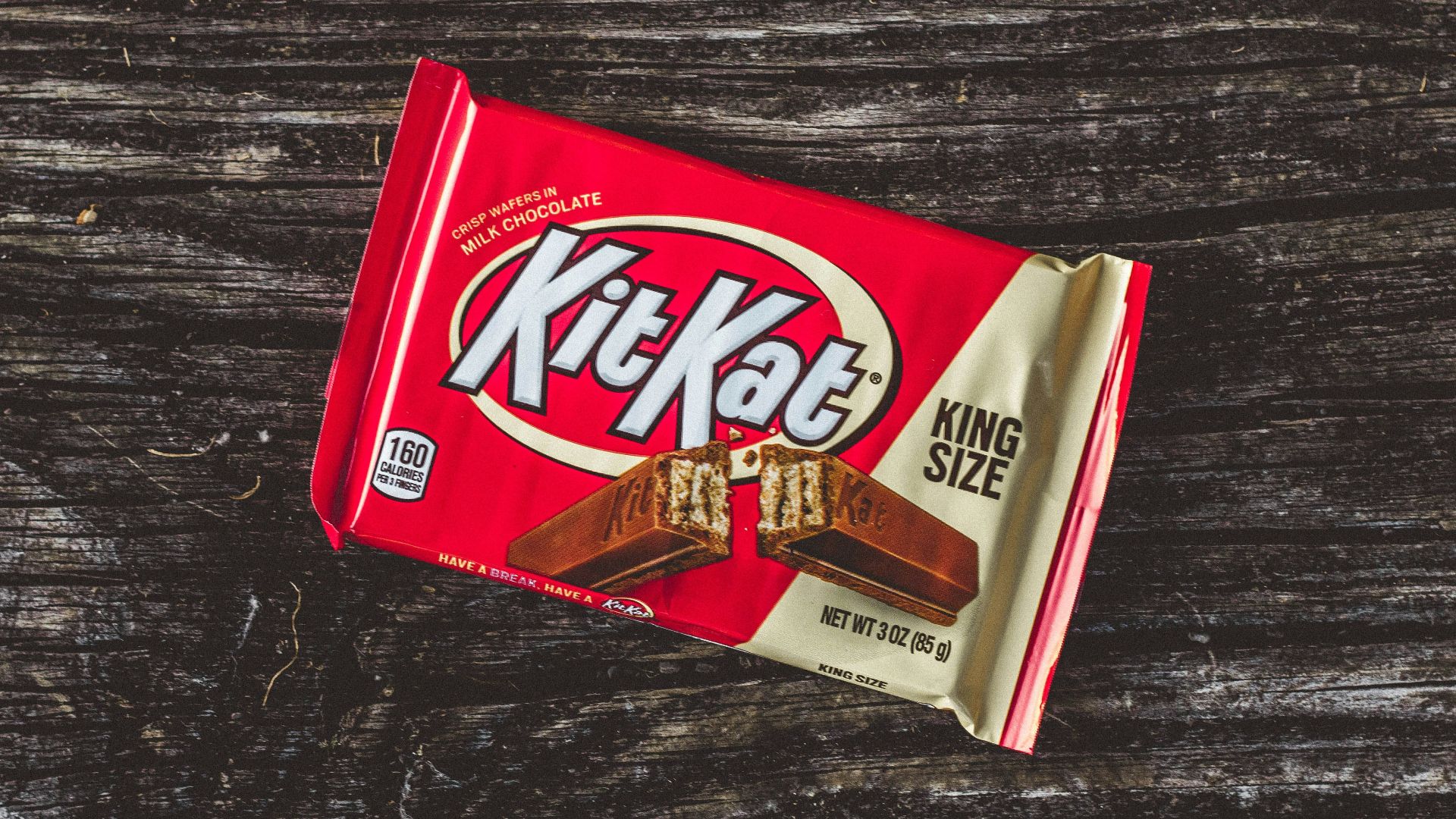kitkat chocolate pack on black textile