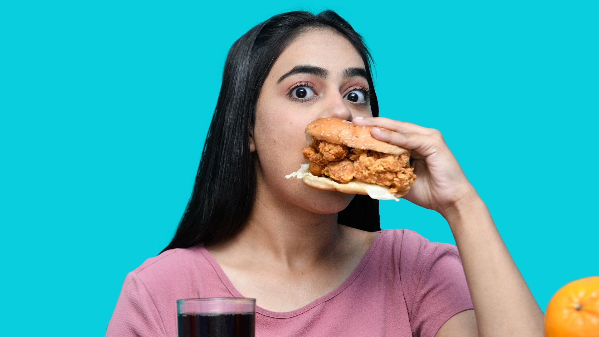a woman eating a sandwich