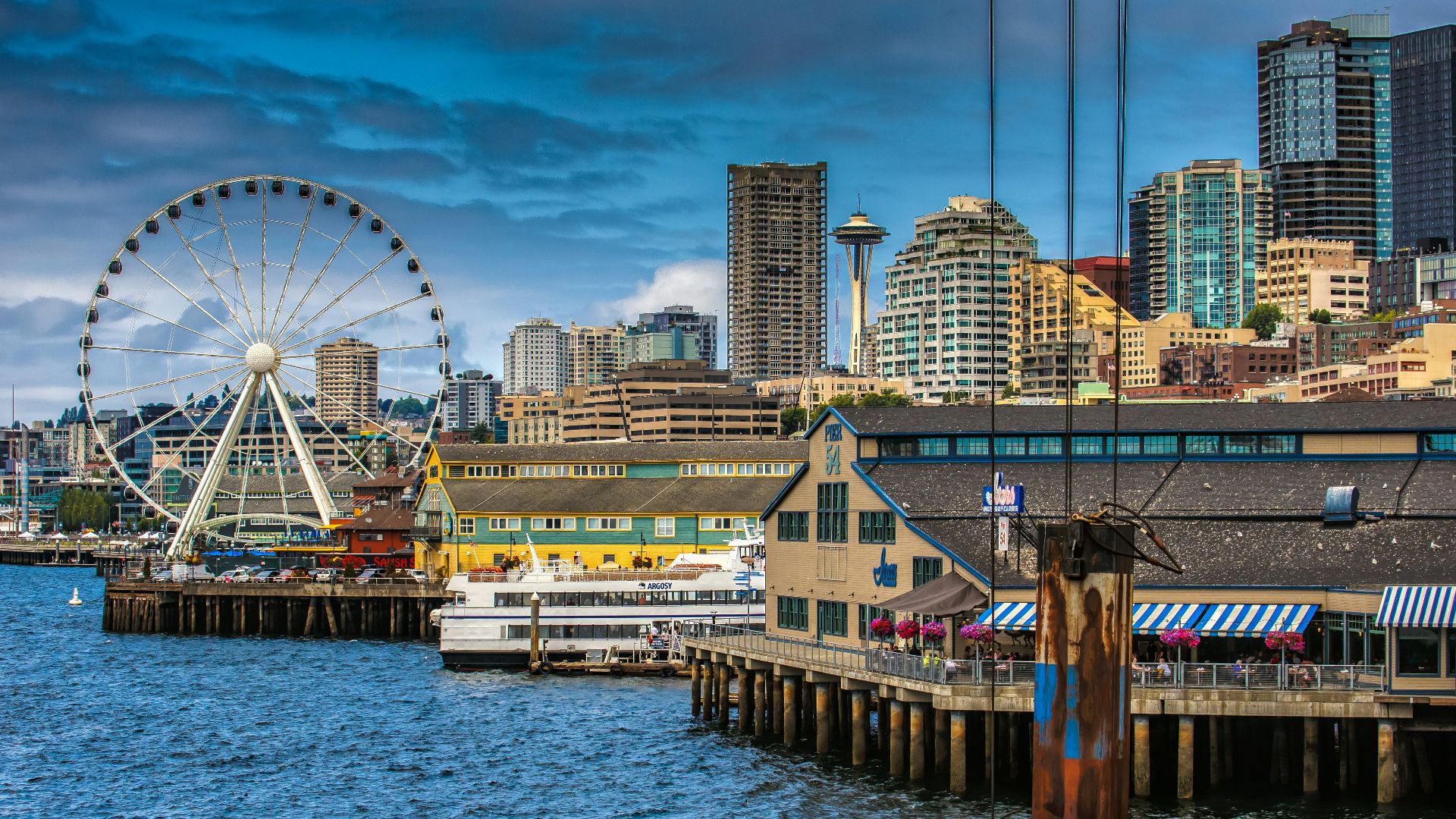 ferris wheel near body of water during daytime