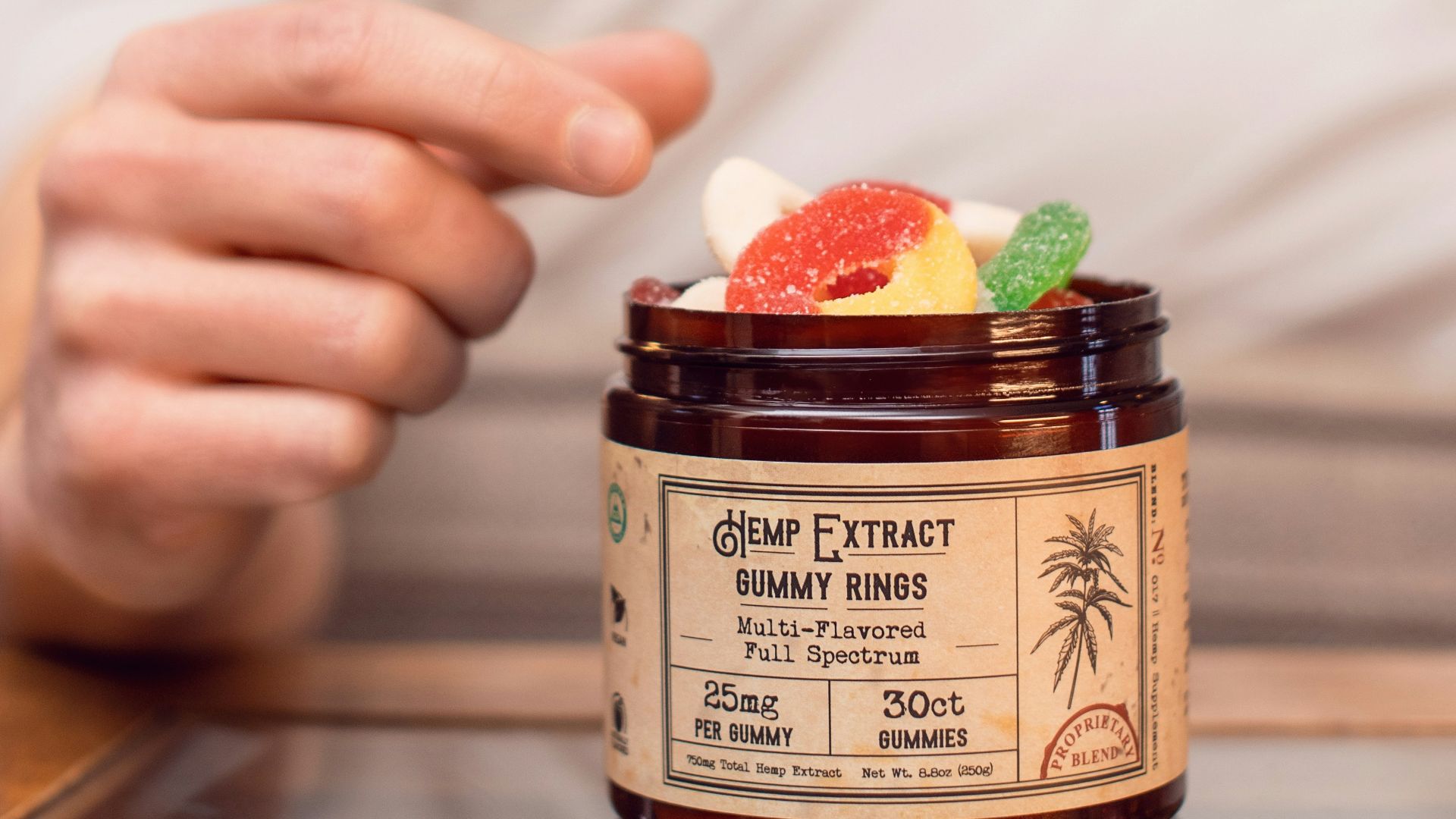 boy in white shirt holding brown glass jar