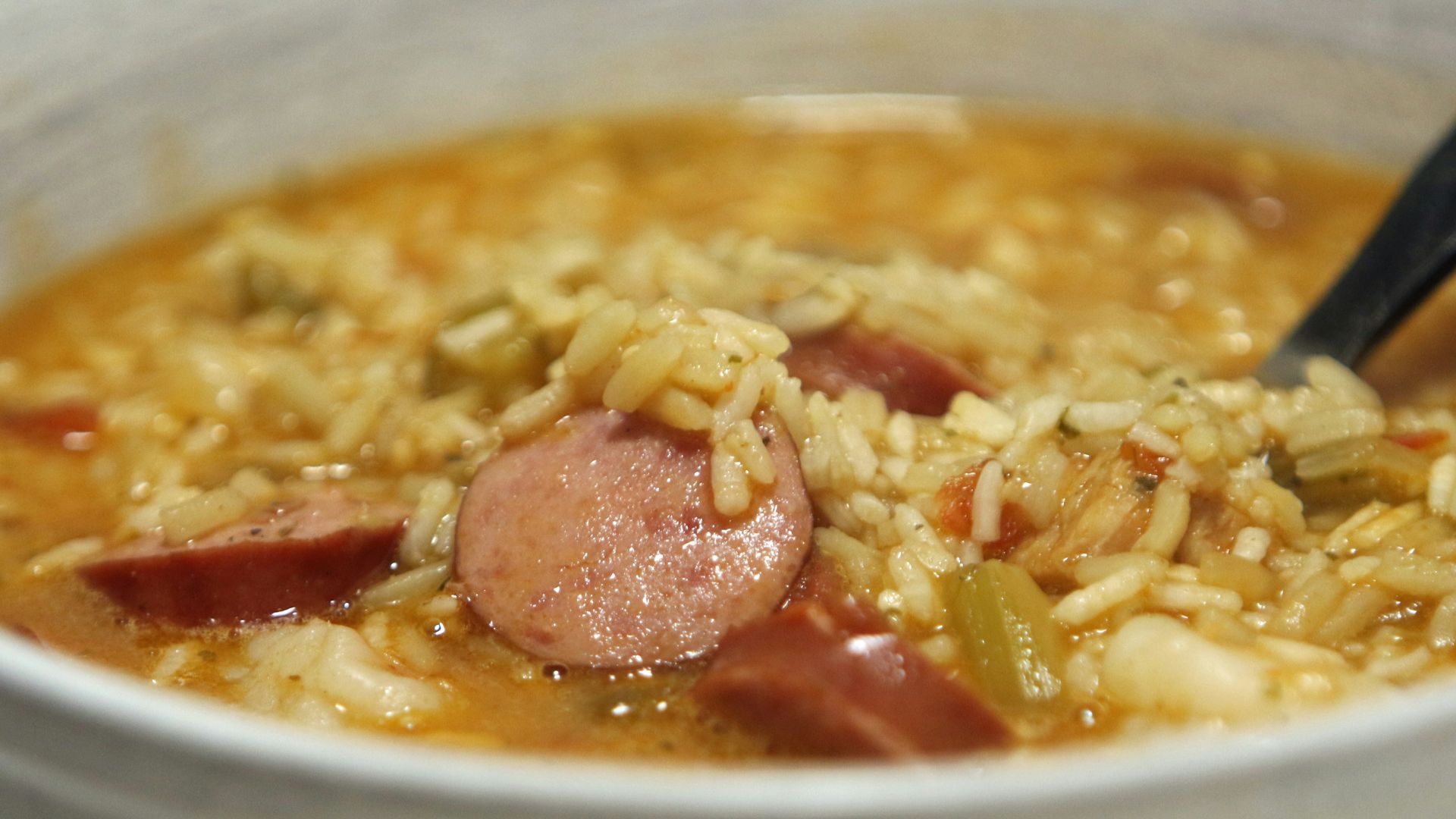 a bowl of soup with a spoon in it