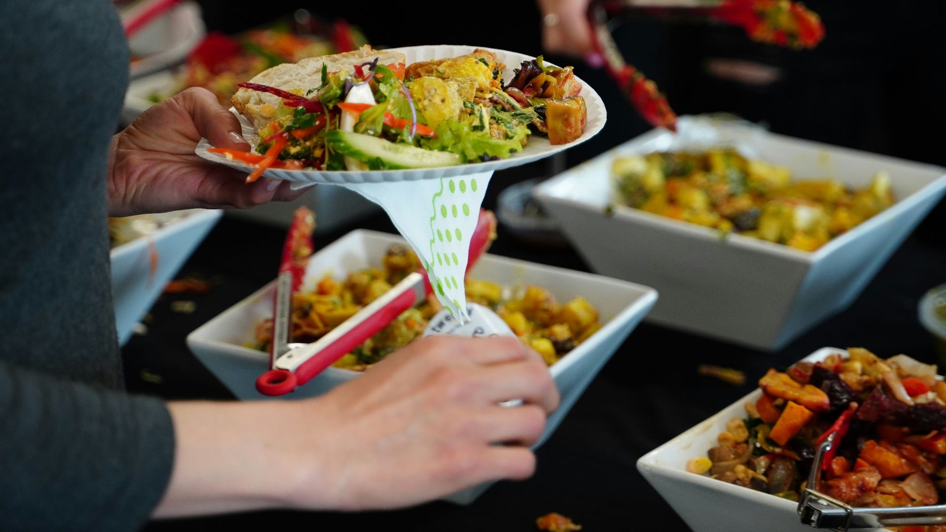 person holding white ceramic bowl with food