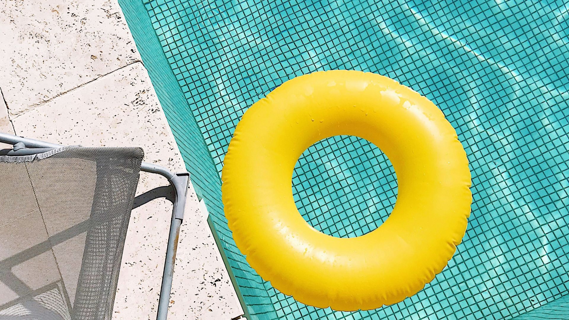 yellow plastic round toy on green table