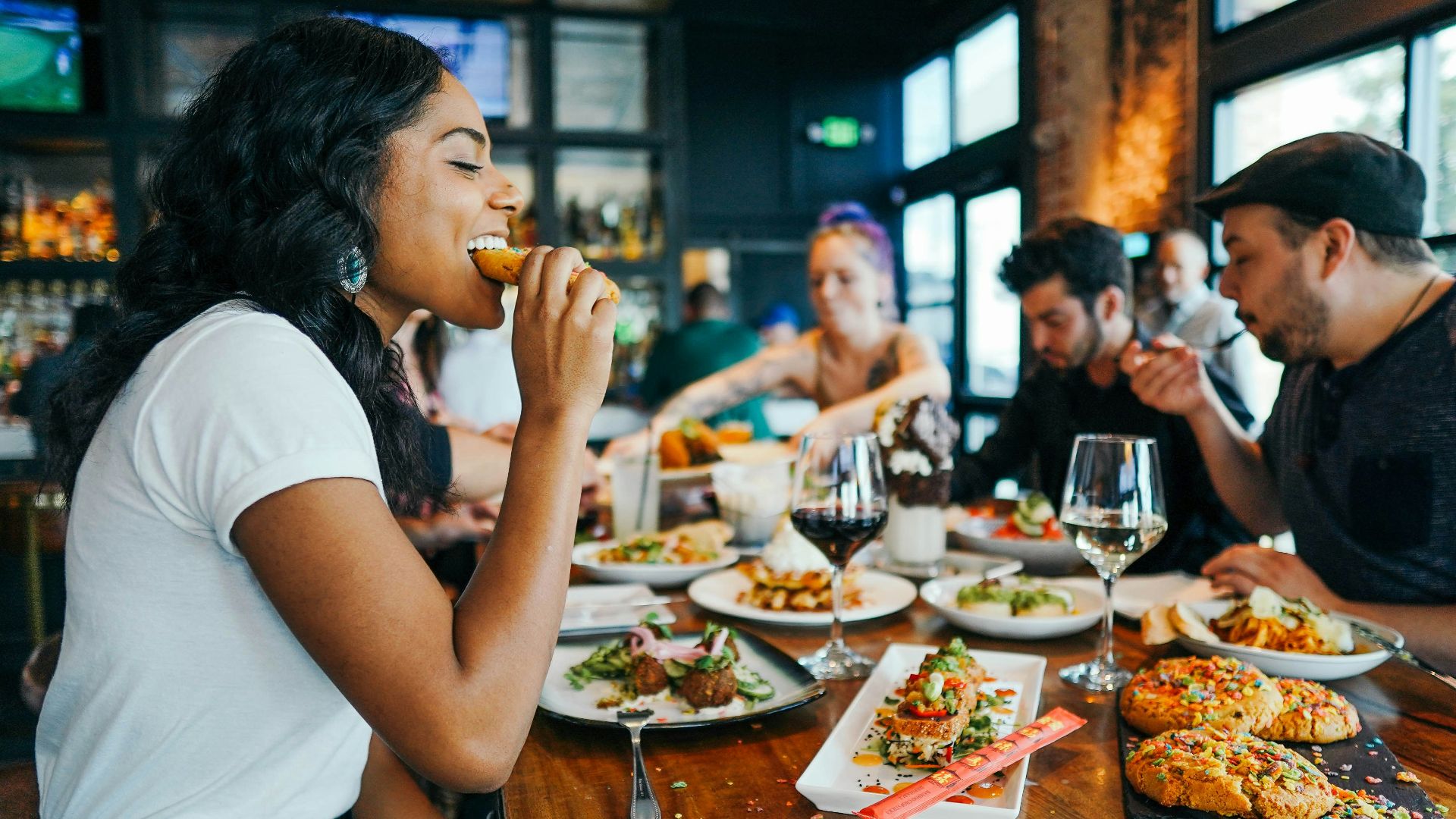 woman in white shirt eating