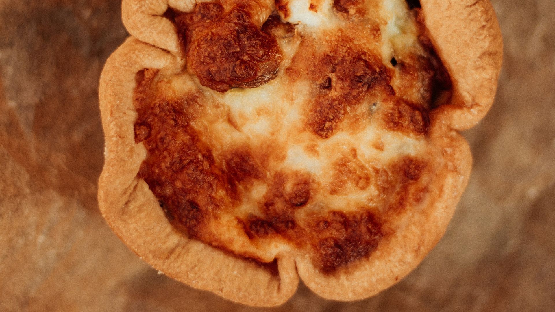 A single baked quiche with a golden crust.