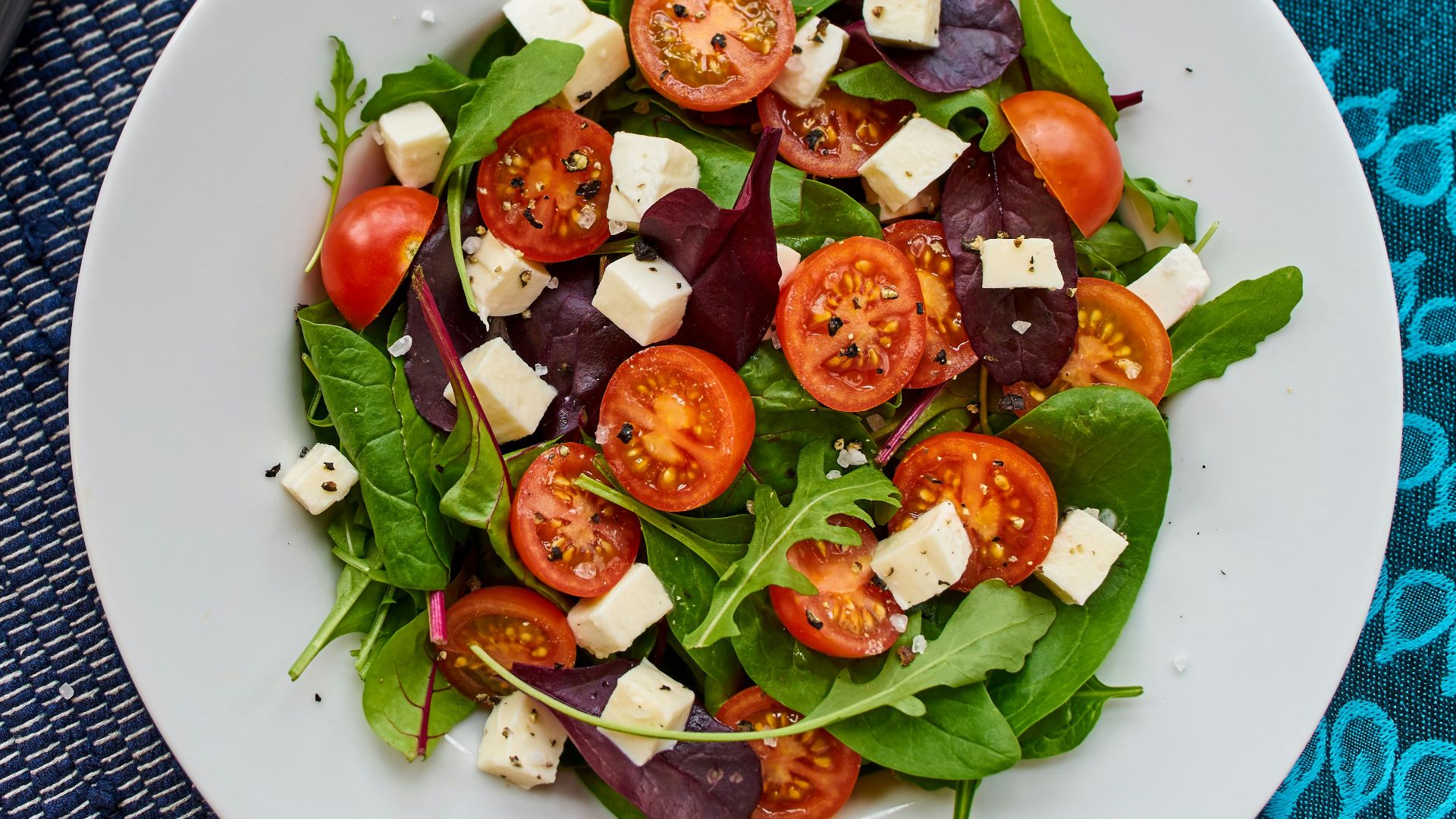 vegetable salad on round white ceramic plate