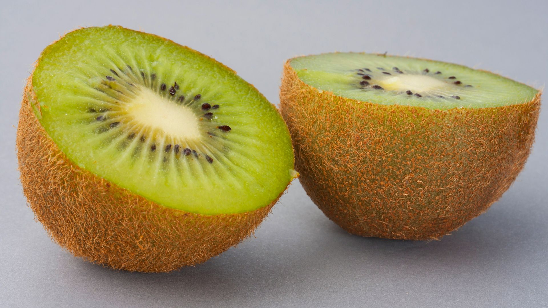 sliced green fruit on white surface