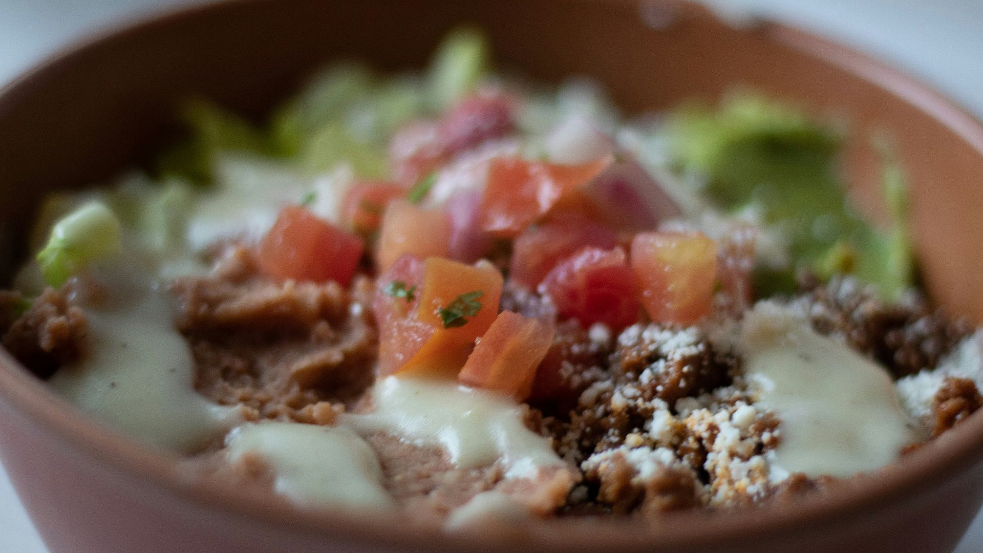a close up of a bowl of food on a table