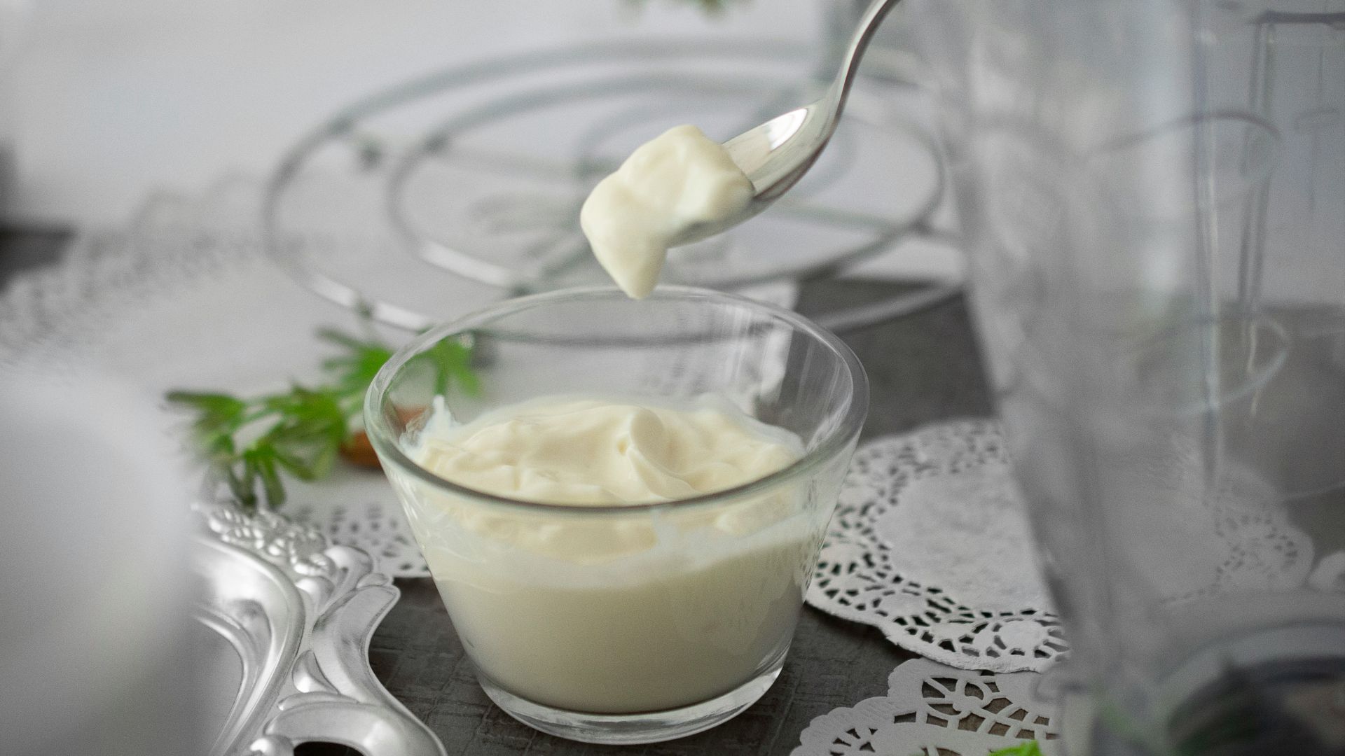 close-up photo of white cream in clear shot glass