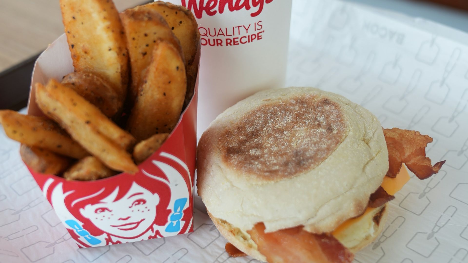 A tray with a sandwich and fries on it