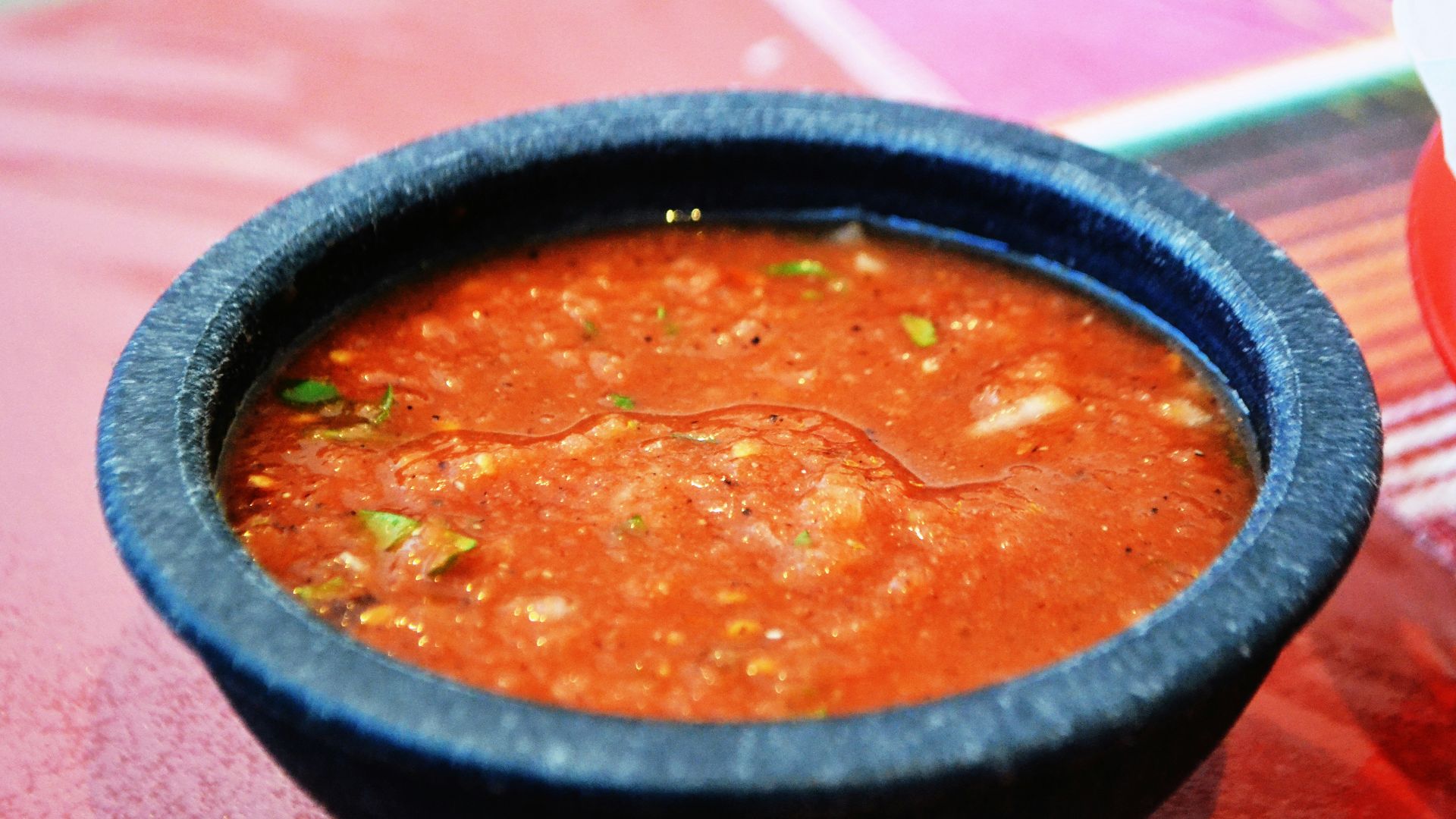 a bowl of soup sitting on top of a table