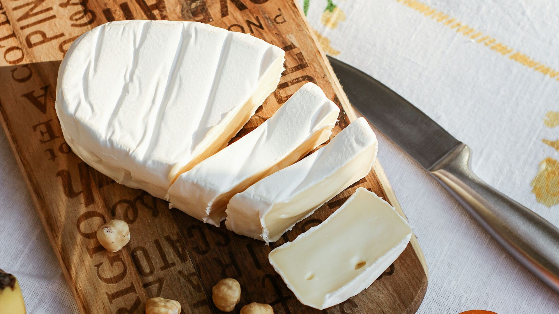 sliced bread on brown wooden chopping board