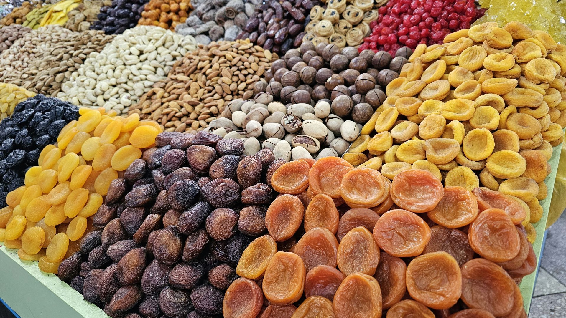 a display of dried fruits and nuts for sale