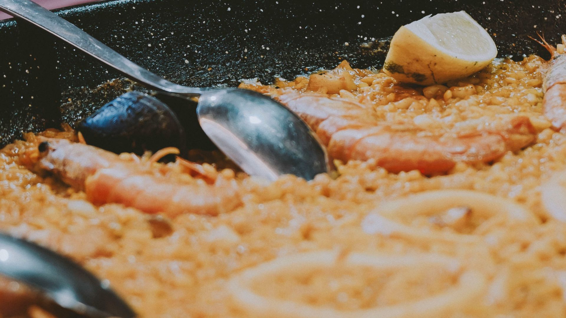 a plate of food and a glass of wine