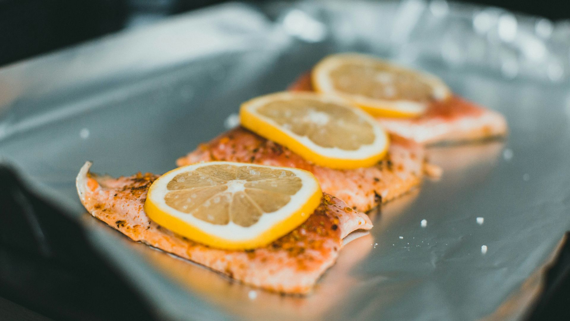 sliced orange fruit on clear glass plate