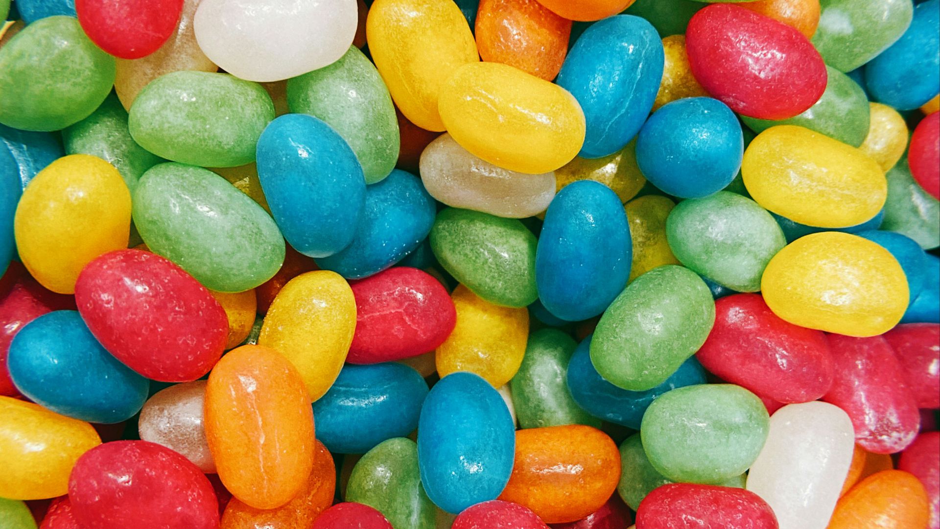 blue yellow and red m ms chocolate candies