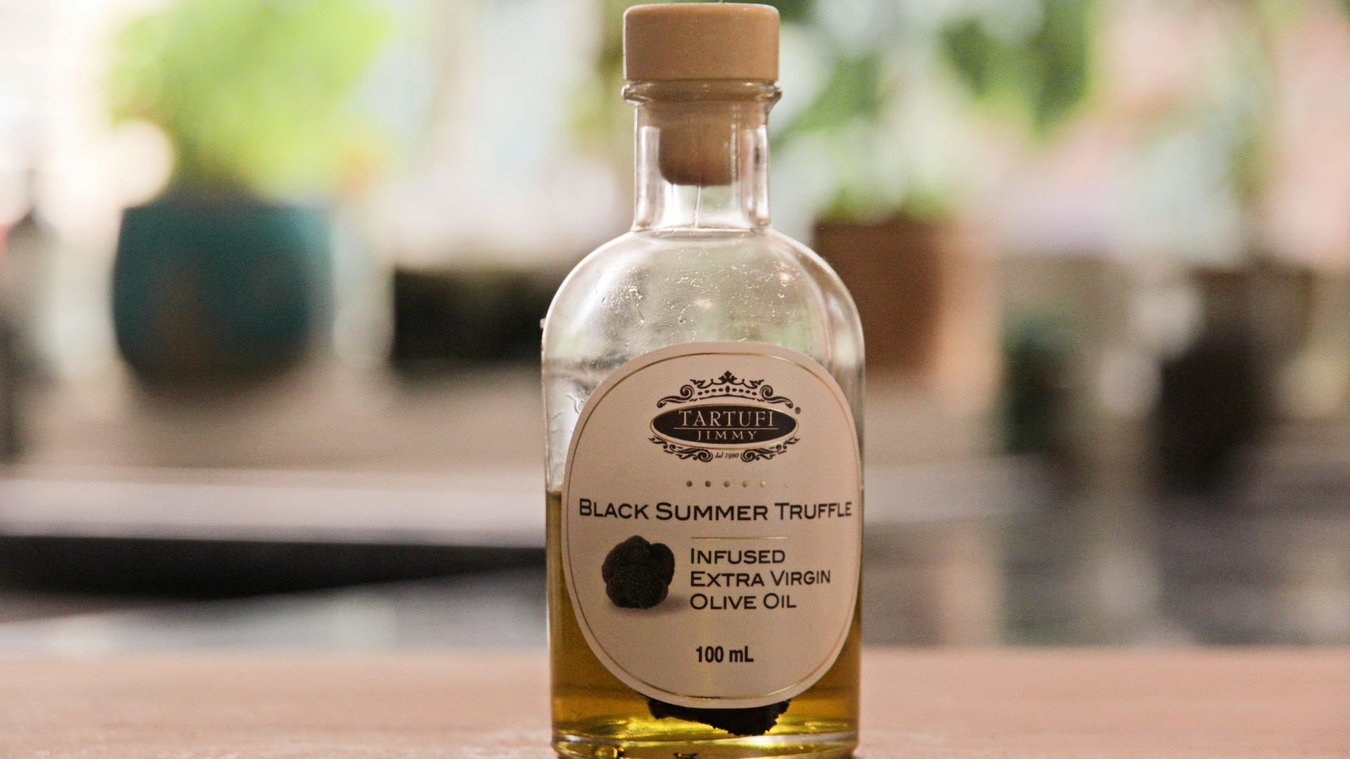 a bottle of black sesame seed oil sitting on a table