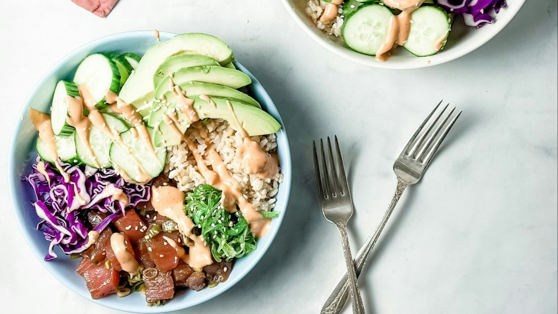 two bowls of food are sitting on a table