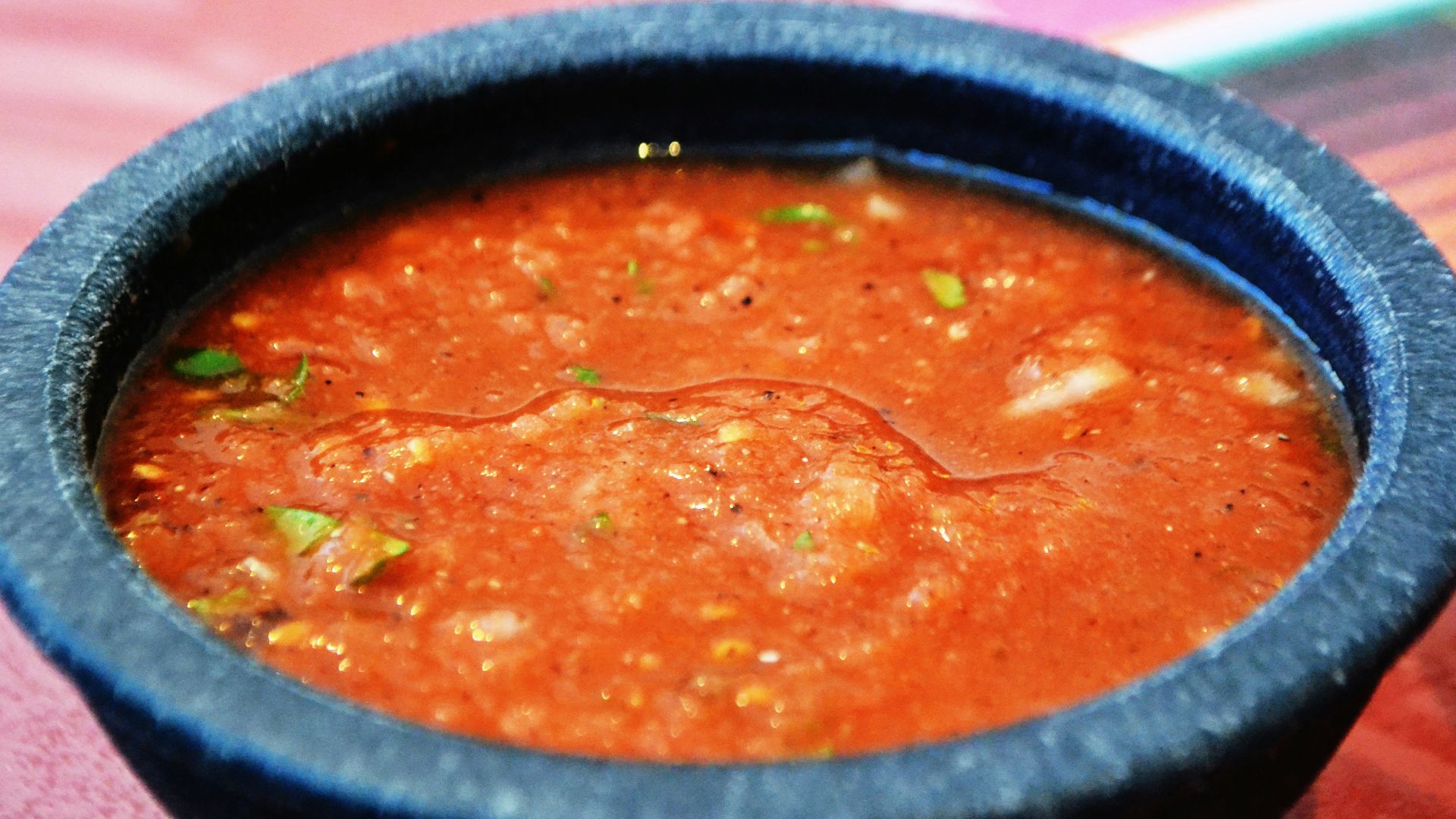 a bowl of soup sitting on top of a table
