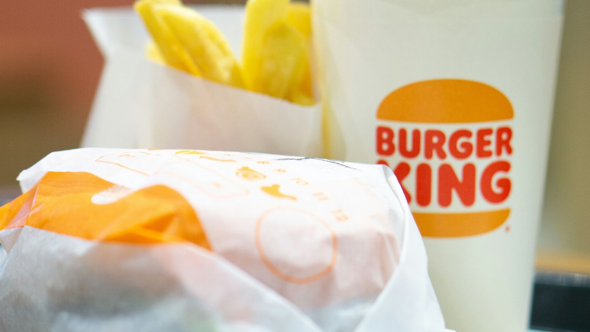 a plate with a sandwich and a cup of coffee