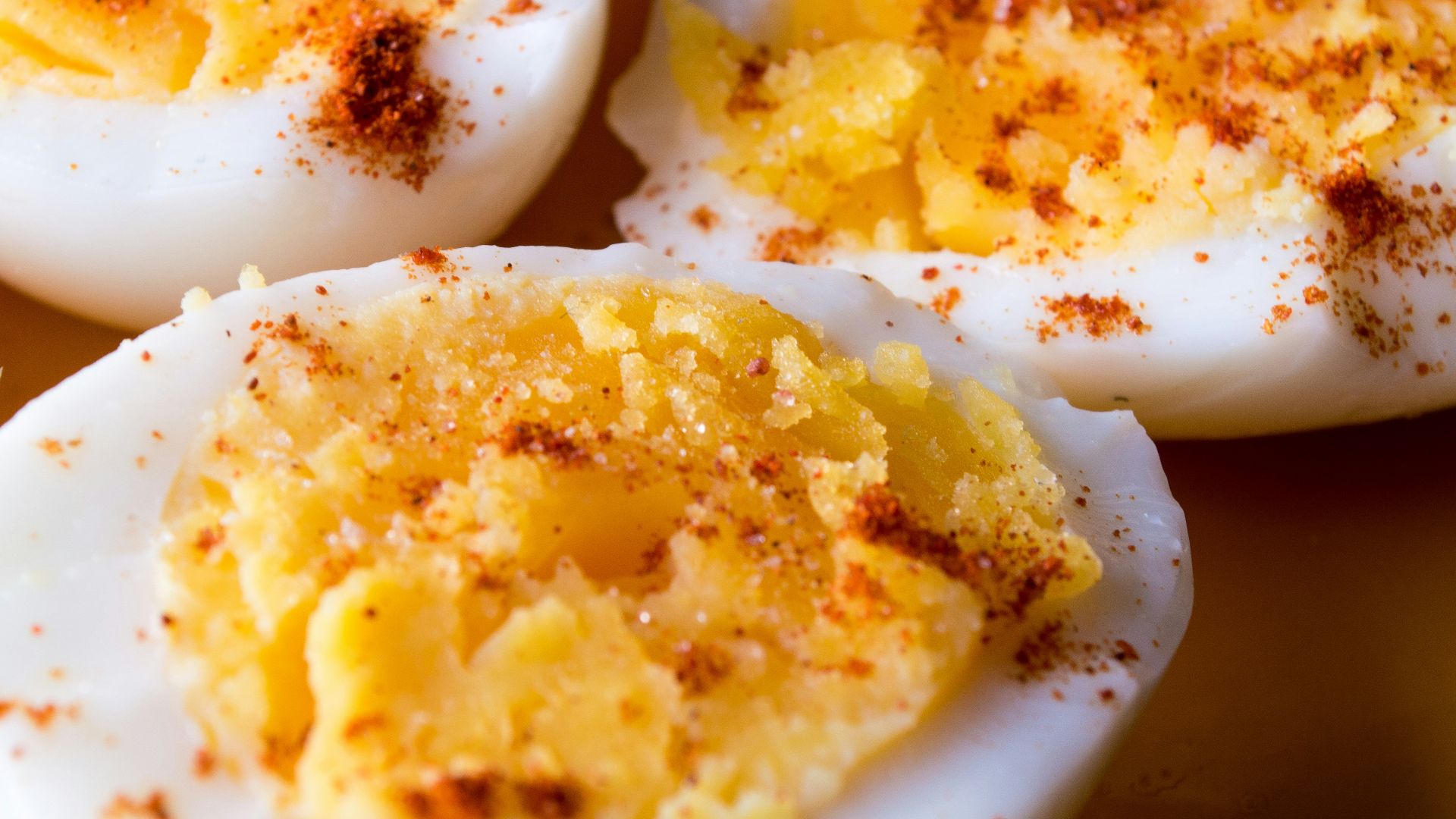 sliced boiled eggs topped with spices