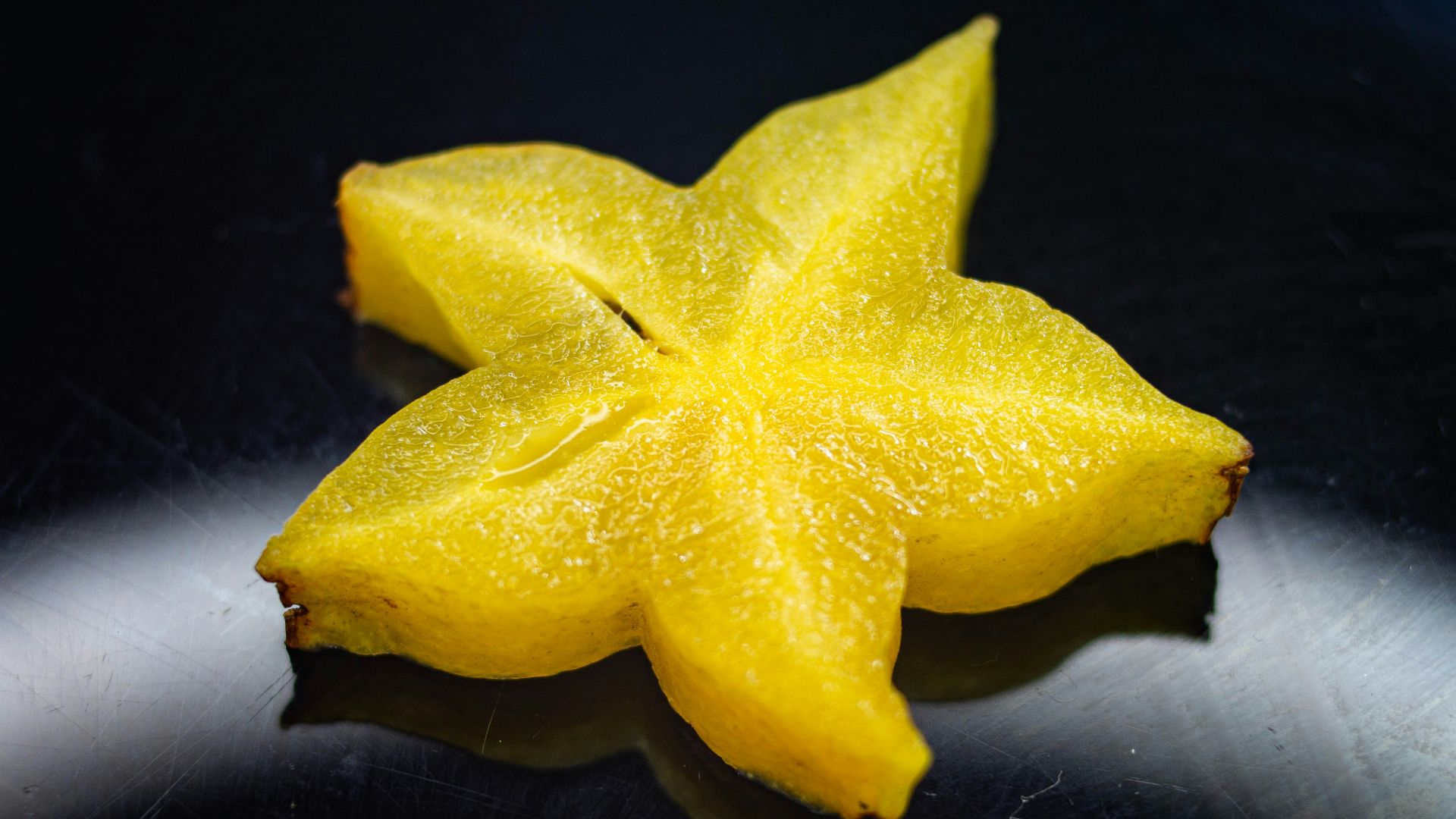 yellow star ornament on black surface