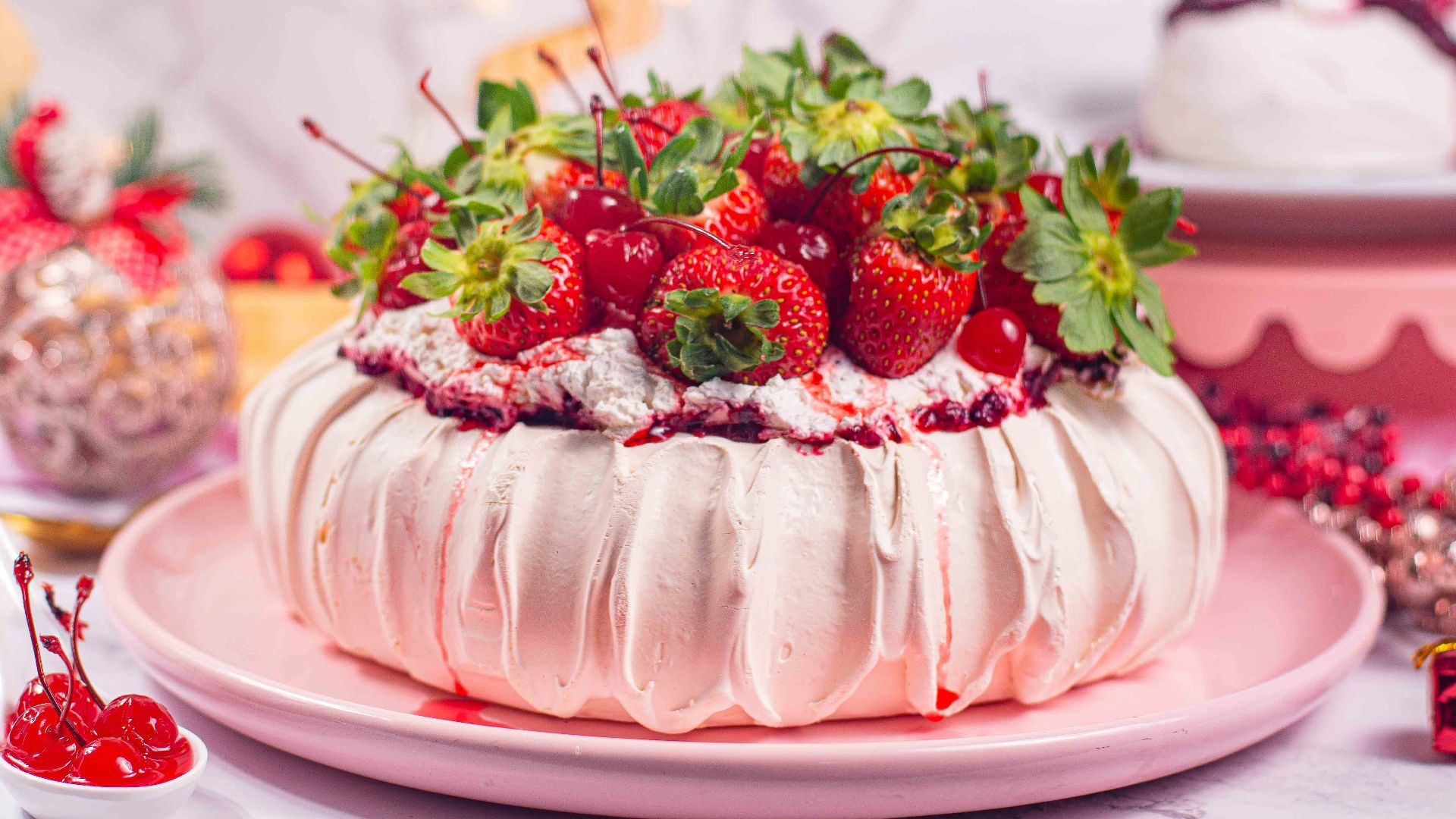 a cake with white frosting and strawberries on top