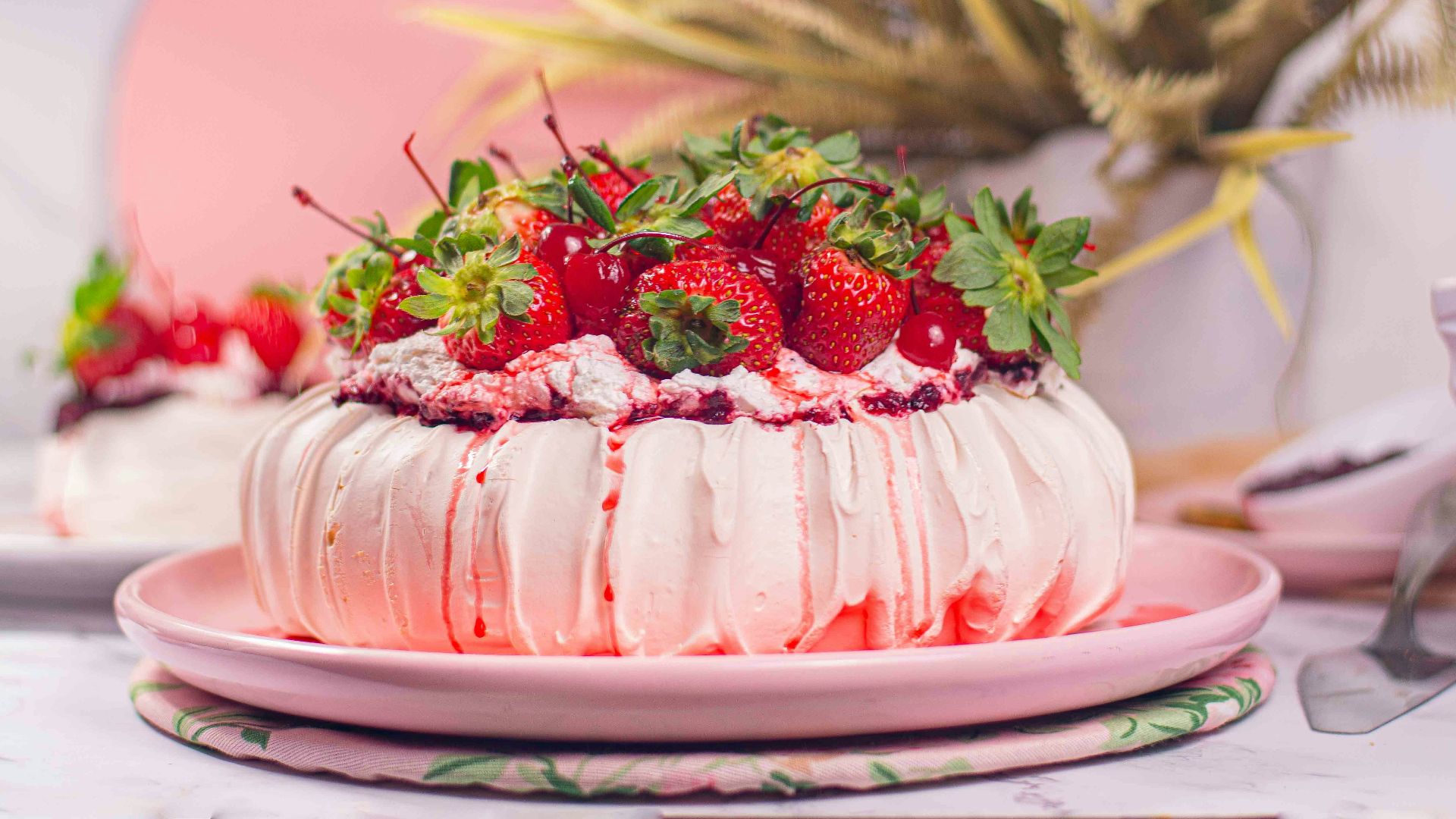 a white cake with strawberries on top of it
