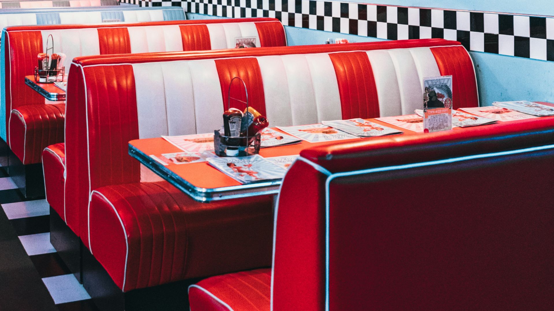 red padded sofa and tables inside building