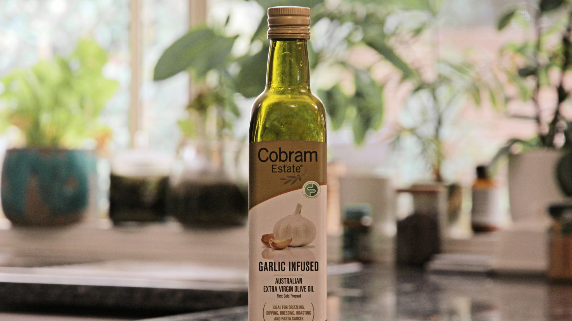 a bottle of garlic oil sitting on top of a counter