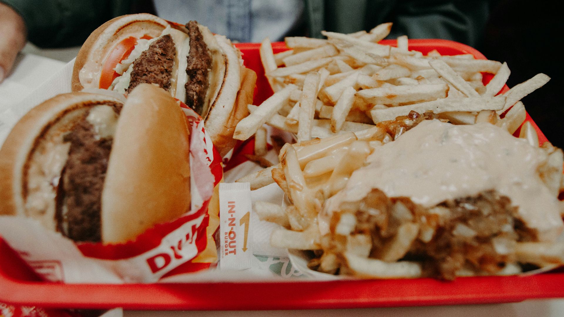 French fries and hamburgers on tray