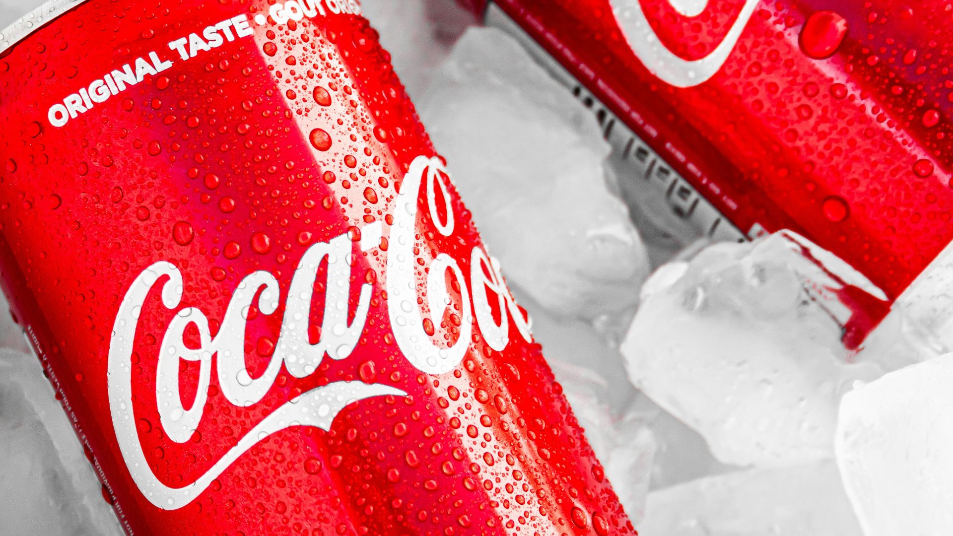 coca cola can on white plastic pack