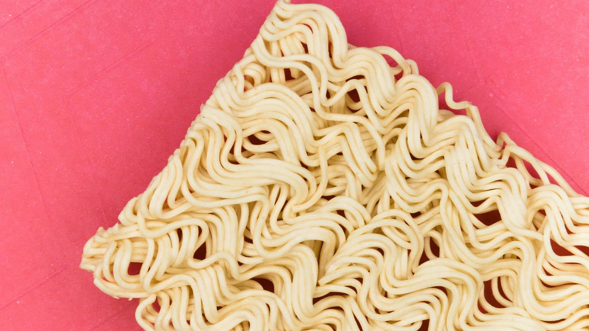 white and blue textile on pink textile