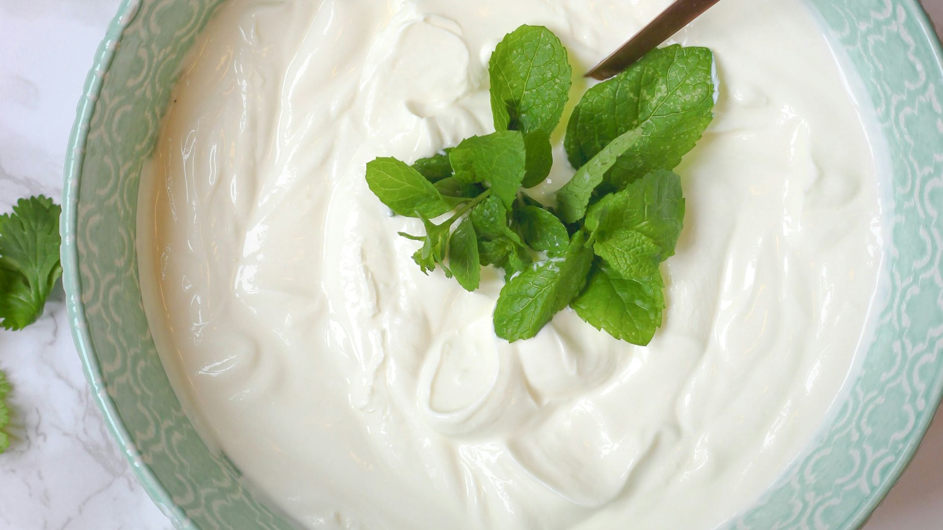 a bowl of yogurt with a spoon in it