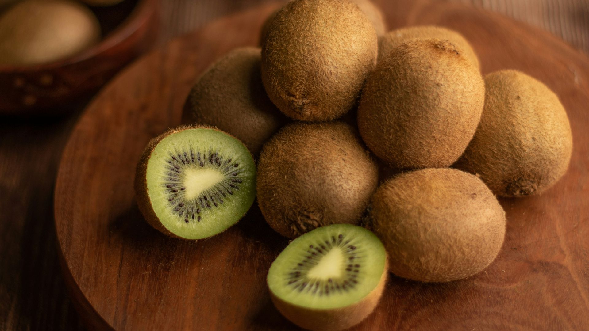 brown round fruit on brown wooden table