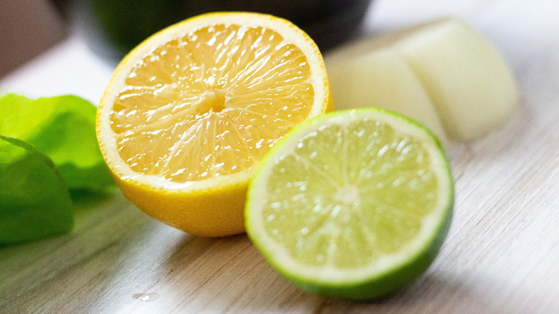 sliced lemon on brown wooden table