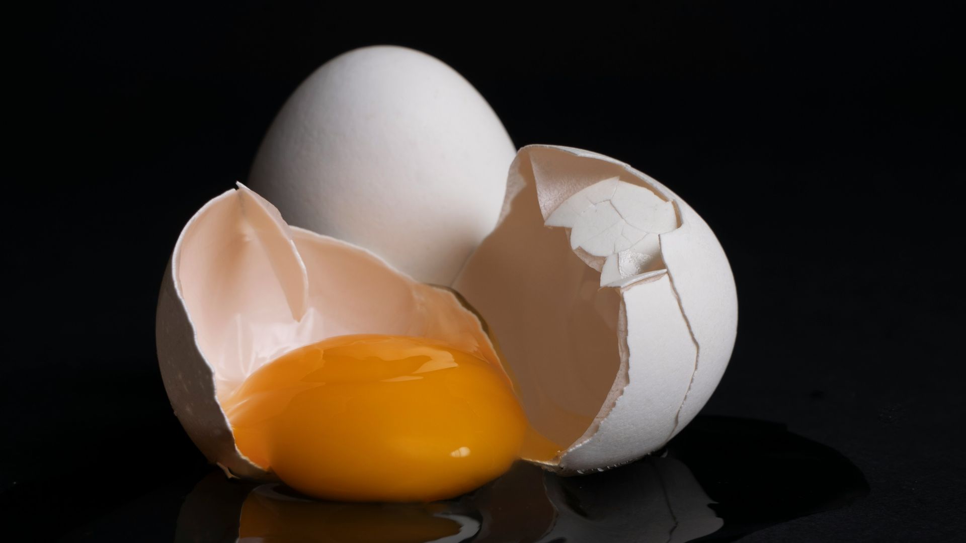 white egg on brown wooden tray