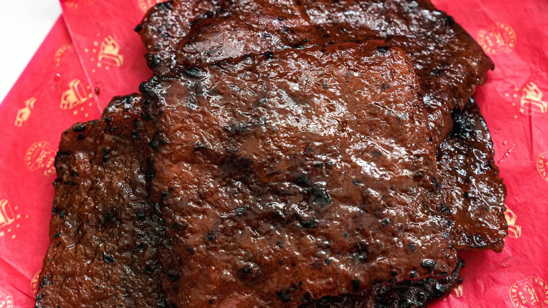 a plate of steak and oranges on a table