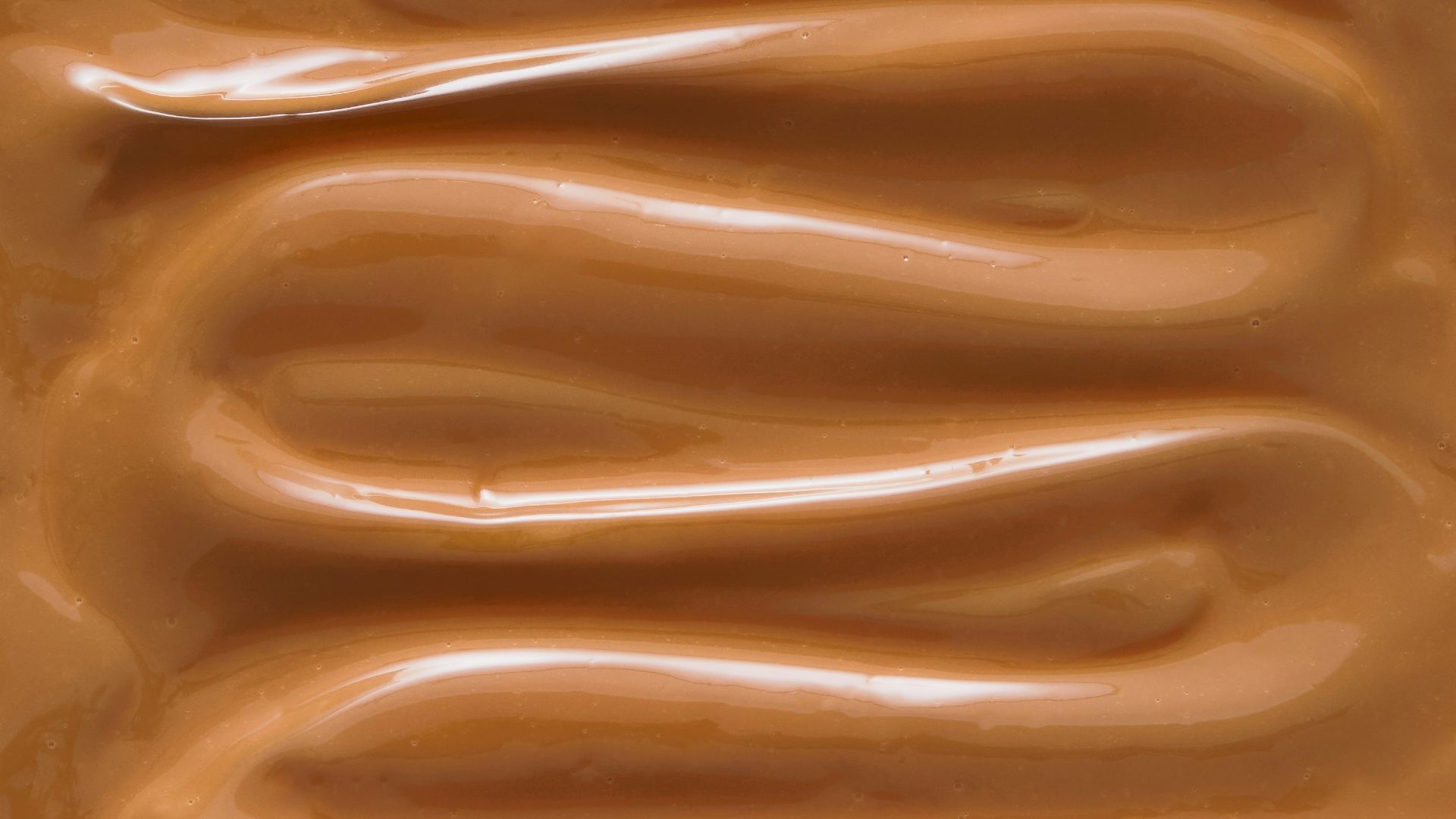 A close up of a chocolate frosted surface