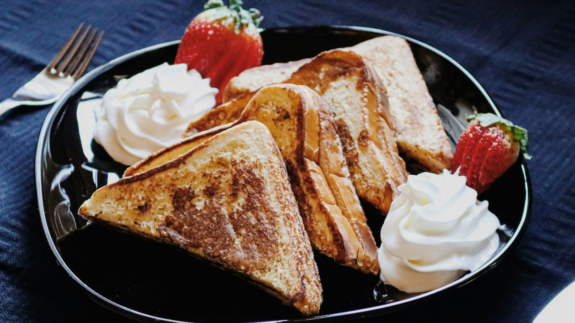 bread on black ceramic plate