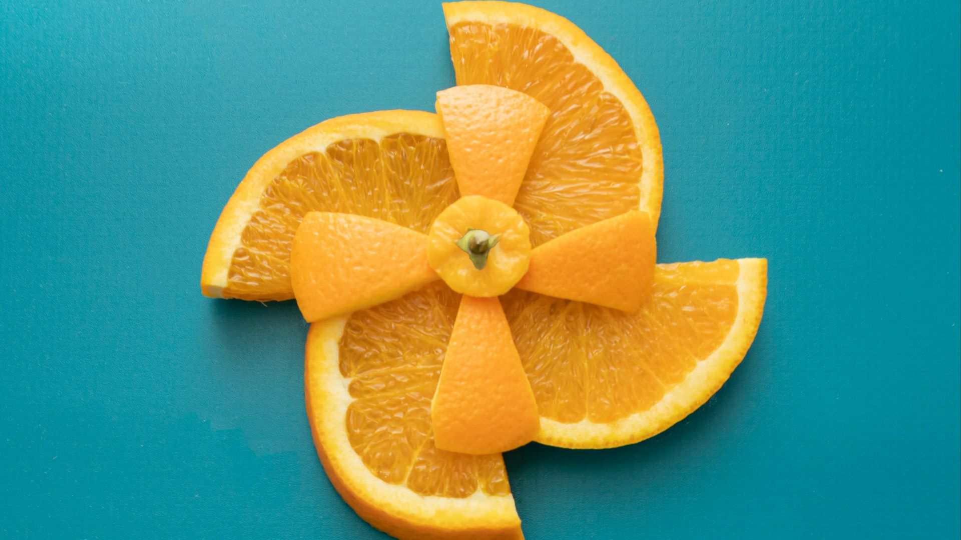 a close up of an orange on a stick