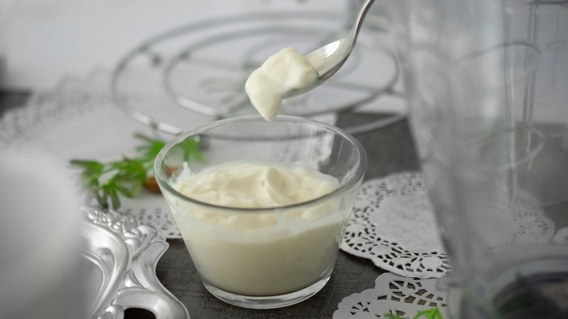 close-up photo of white cream in clear shot glass
